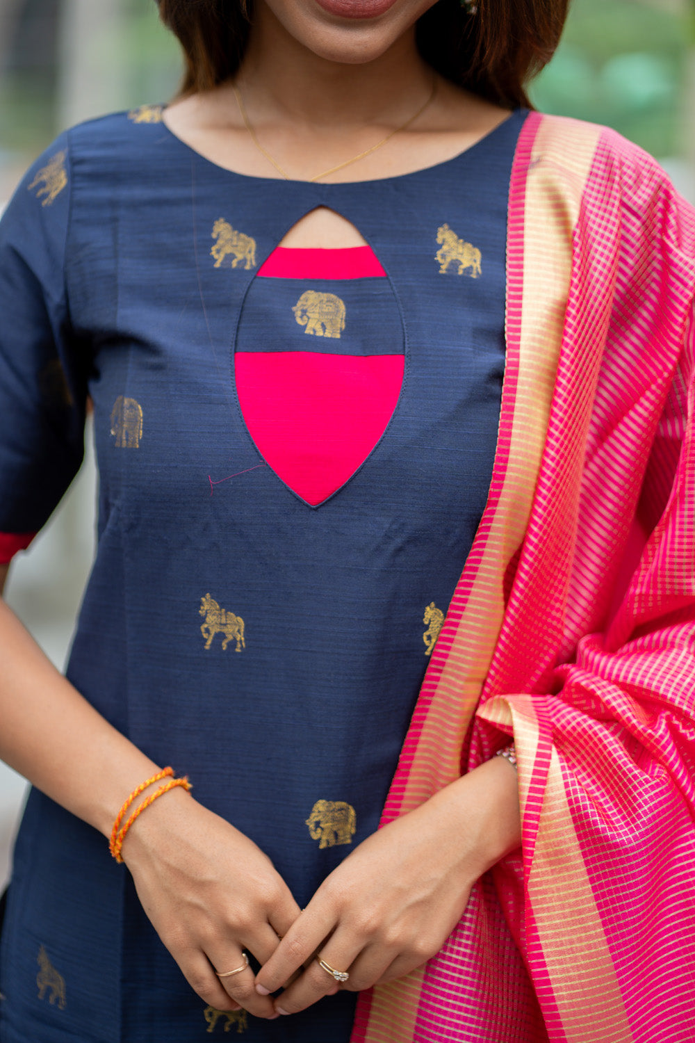 Dark Blue Raw Silk Kurti with Golden Elephant & Horse motifs Paired with Rani Pink Zari Checks Dupatta(Neck & sleeve patched with Rani pink Silk fabric)
