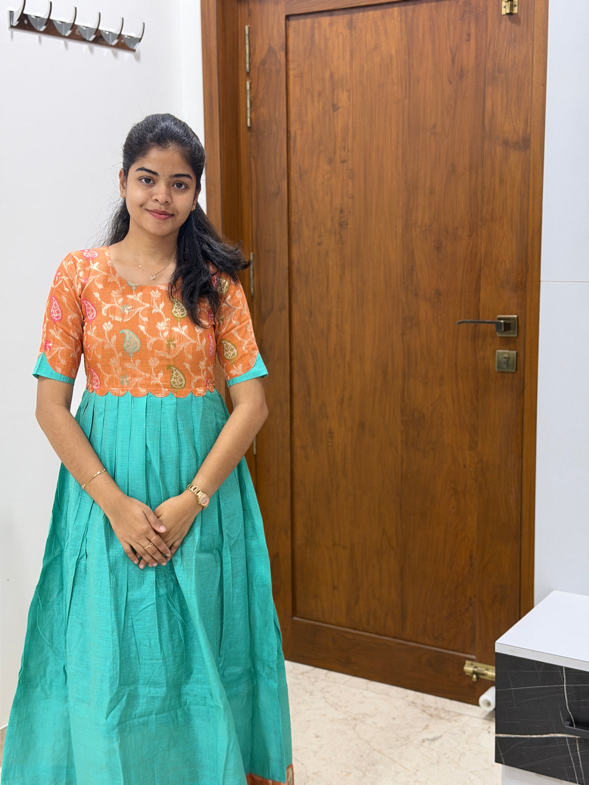 AA307  Orange Jacquard Brocade Silk with Multicolour Zari in Yoke part combined with Blue full flared Skirt with Jacquard Border