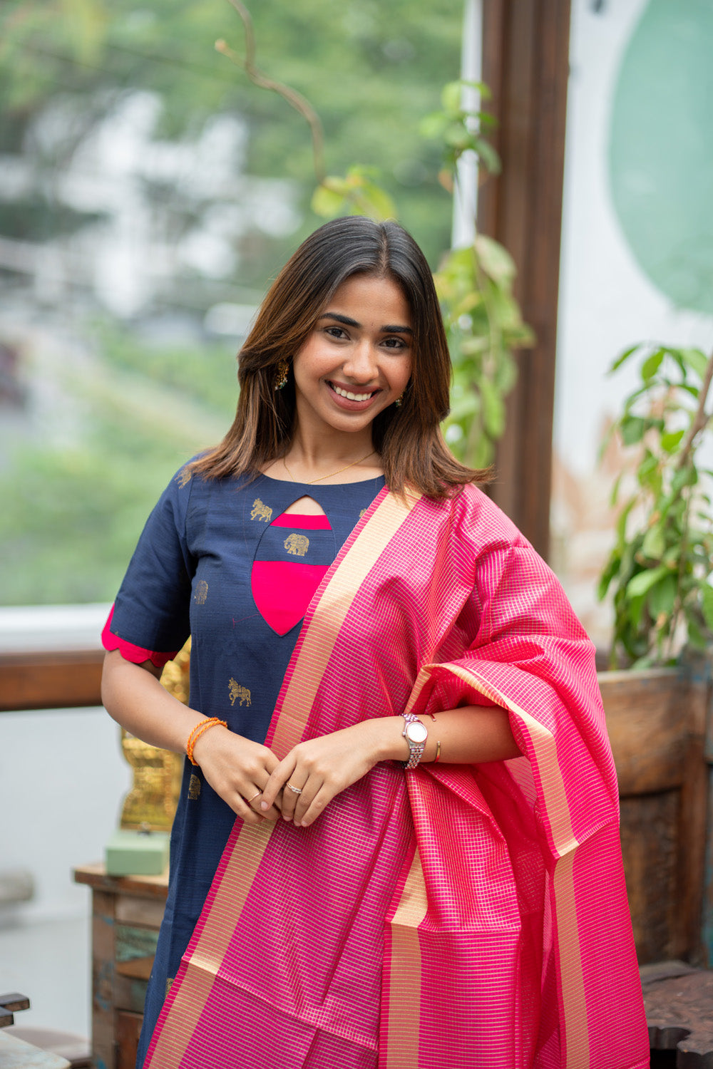 Dark Blue Raw Silk Kurti with Golden Elephant & Horse motifs Paired with Rani Pink Zari Checks Dupatta(Neck & sleeve patched with Rani pink Silk fabric)