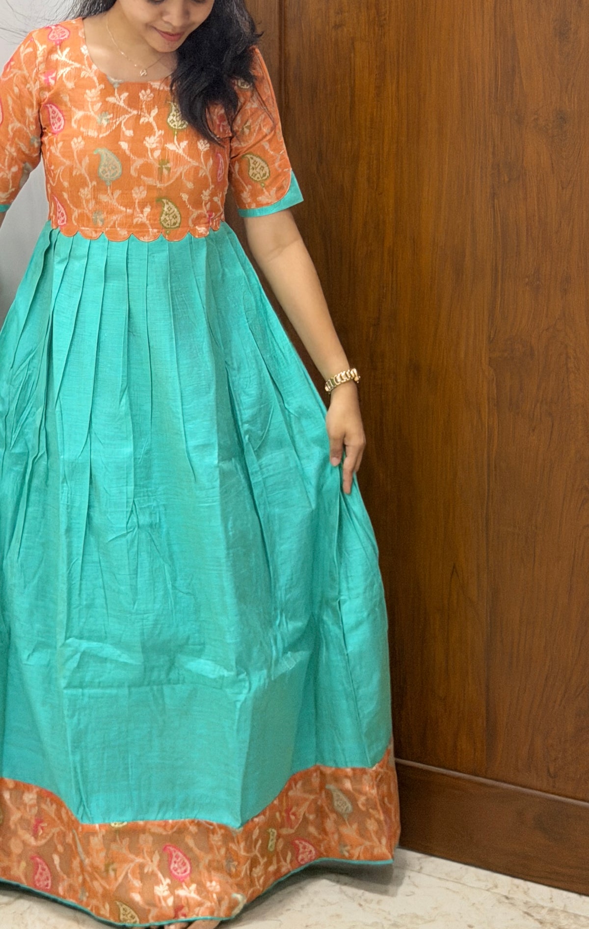 AA307  Orange Jacquard Brocade Silk with Multicolour Zari in Yoke part combined with Blue full flared Skirt with Jacquard Border