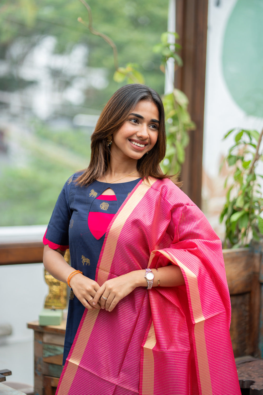 Dark Blue Raw Silk Kurti with Golden Elephant & Horse motifs Paired with Rani Pink Zari Checks Dupatta(Neck & sleeve patched with Rani pink Silk fabric)