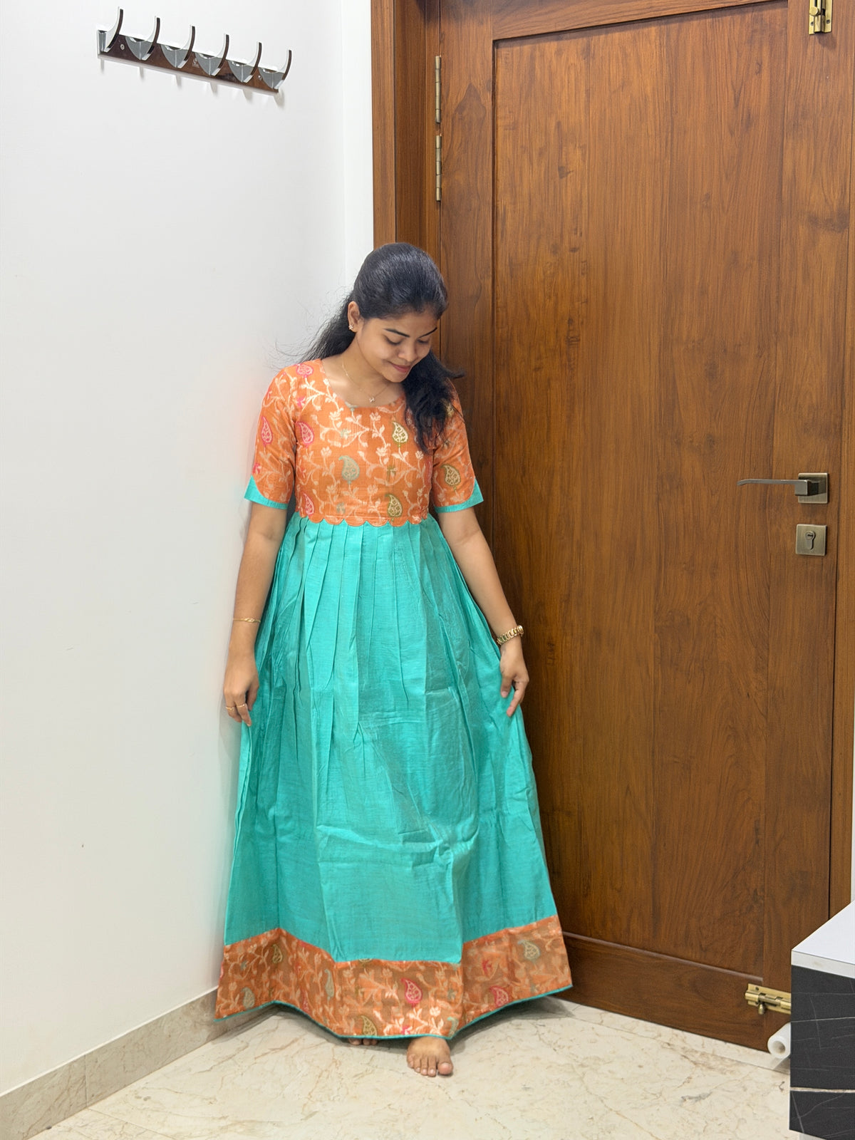 AA307  Orange Jacquard Brocade Silk with Multicolour Zari in Yoke part combined with Blue full flared Skirt with Jacquard Border