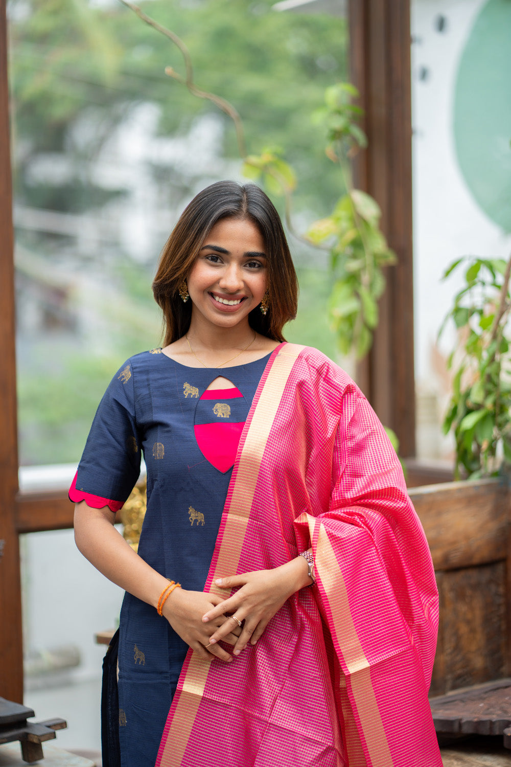 Dark Blue Raw Silk Kurti with Golden Elephant & Horse motifs Paired with Rani Pink Zari Checks Dupatta(Neck & sleeve patched with Rani pink Silk fabric)
