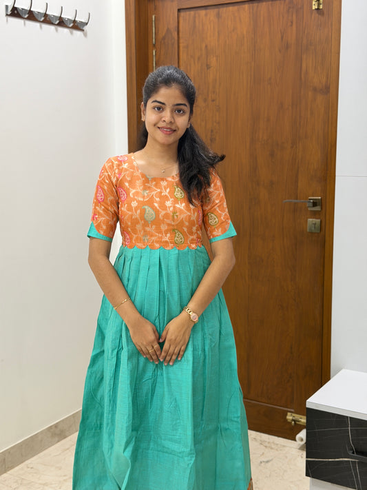 AA307  Orange Jacquard Brocade Silk with Multicolour Zari in Yoke part combined with Blue full flared Skirt with Jacquard Border