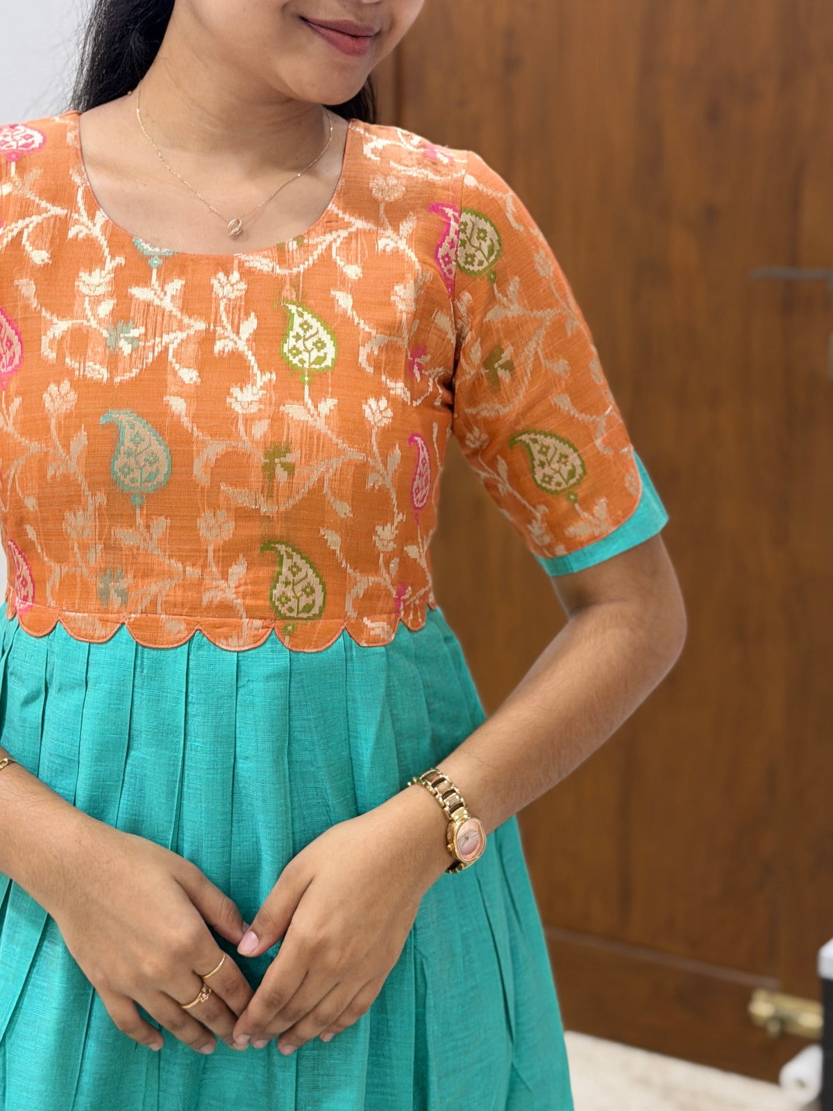 AA307  Orange Jacquard Brocade Silk with Multicolour Zari in Yoke part combined with Blue full flared Skirt with Jacquard Border