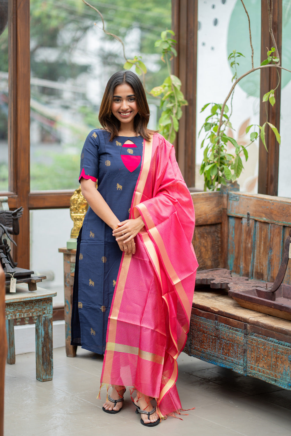 Dark Blue Raw Silk Kurti with Golden Elephant & Horse motifs Paired with Rani Pink Zari Checks Dupatta(Neck & sleeve patched with Rani pink Silk fabric)