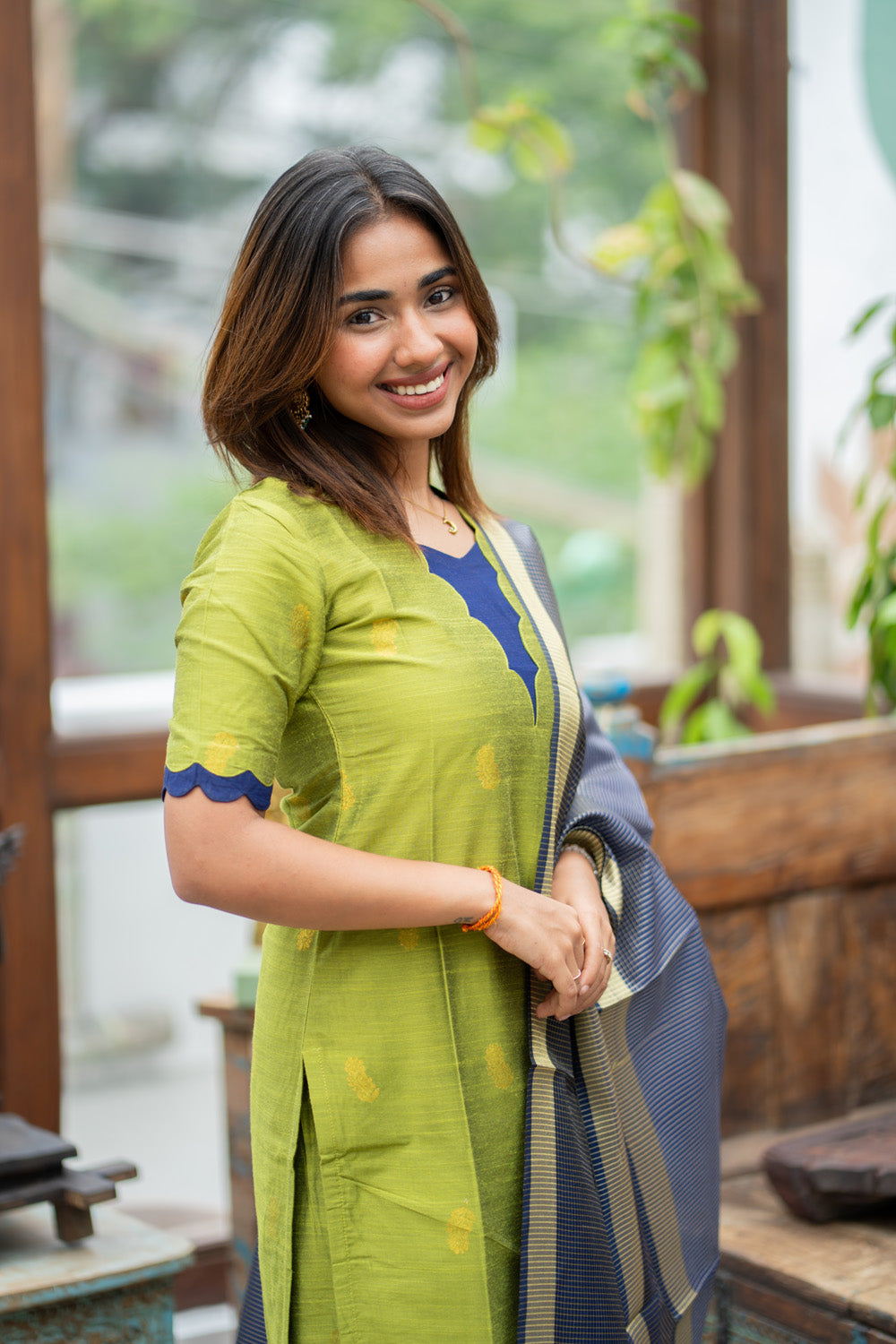 Parrot Green Raw Silk Kurti & Pant with Golden Floral Motifs Paired with Blue Zari Checks Dupatta(Neck & Sleeve patched with Blue semi raw Silk Fabric)