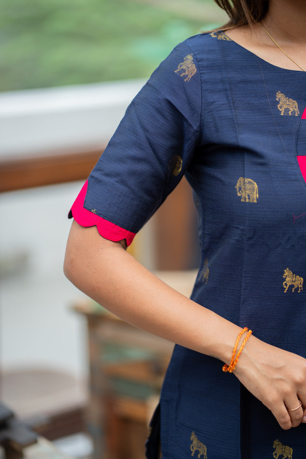Dark Blue Raw Silk Kurti with Golden Elephant & Horse motifs Paired with Rani Pink Zari Checks Dupatta(Neck & sleeve patched with Rani pink Silk fabric)